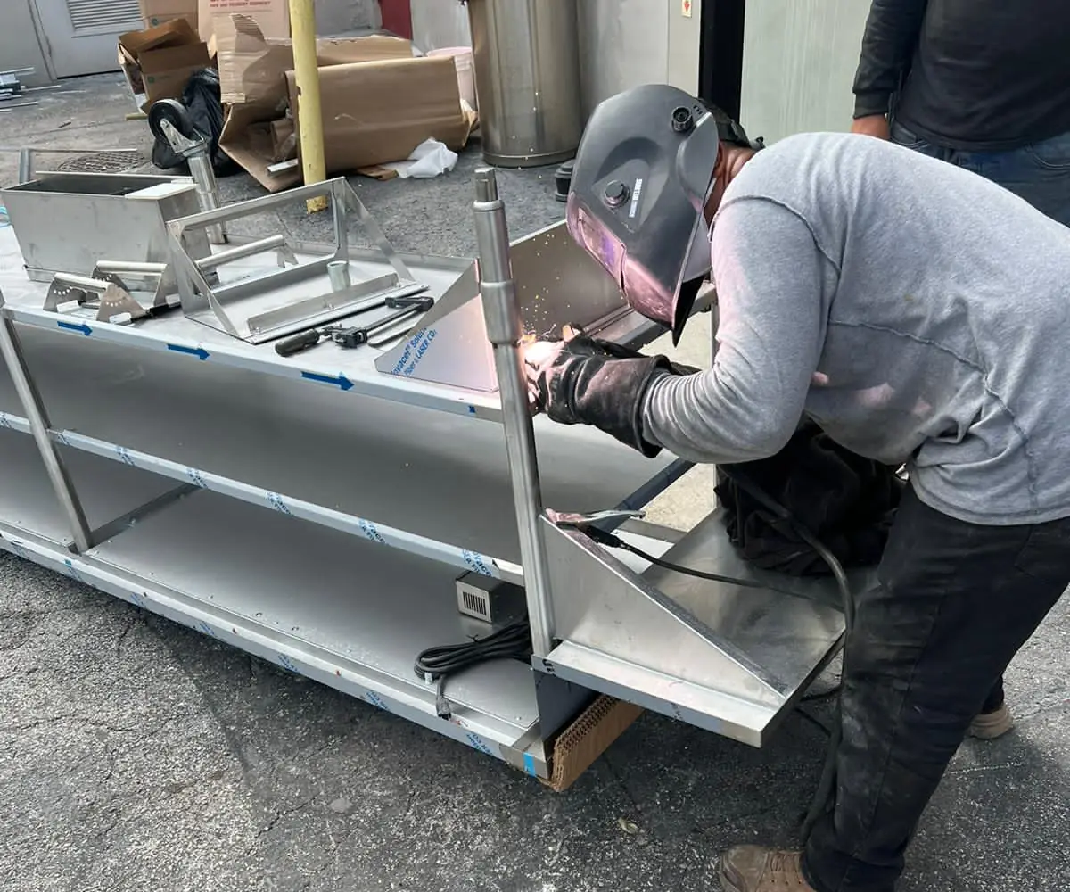 Welder joining an aluminum frame on site